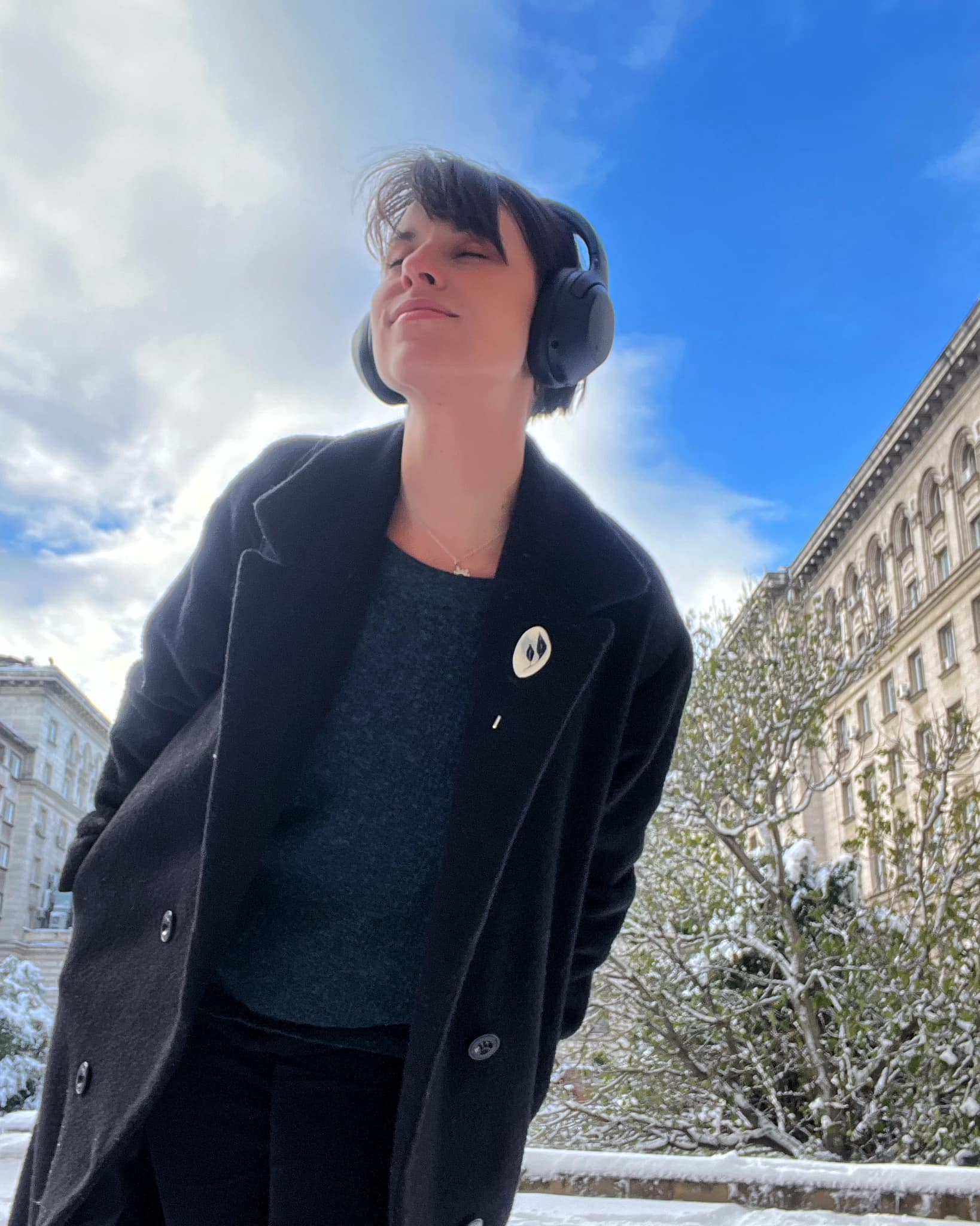 grey pin on black coat in sofia