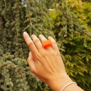 orange ring in greenery