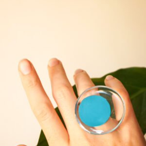 teal ring on hand