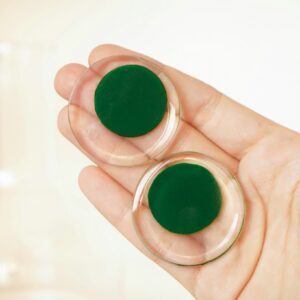 circle earrings green in hand
