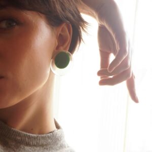 circle earrings green on person