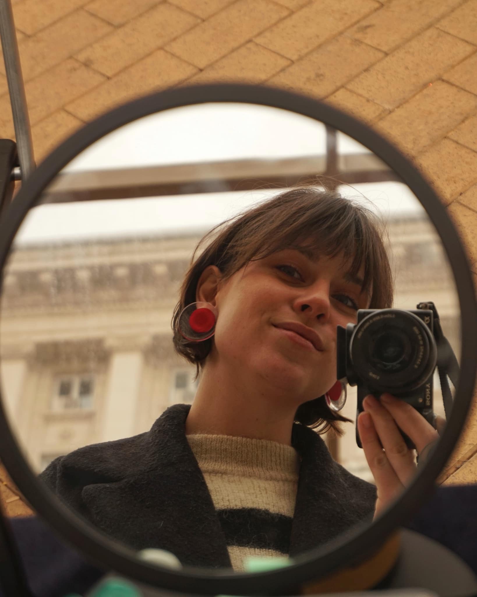 circle earrings red on person